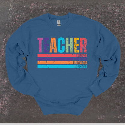 Teacher Believer Innovator Motivator Educator - Teacher Crewneck Sweatshirt - Adult Sweatshirts Crewneck Sweatshirt Graphic Avenue Indigo Blue Adult Small 